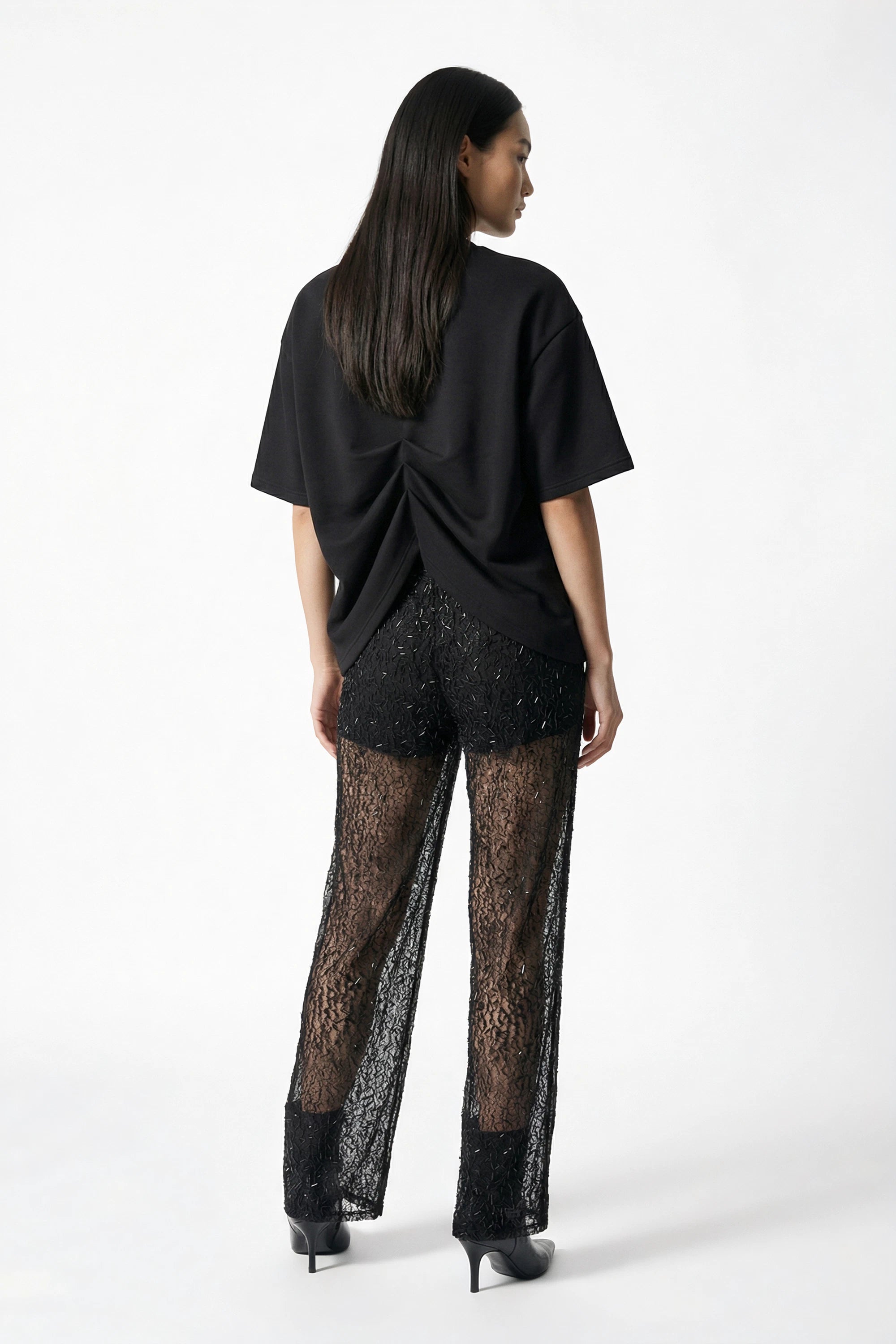 Pantalone semi-trasparente con paillettes